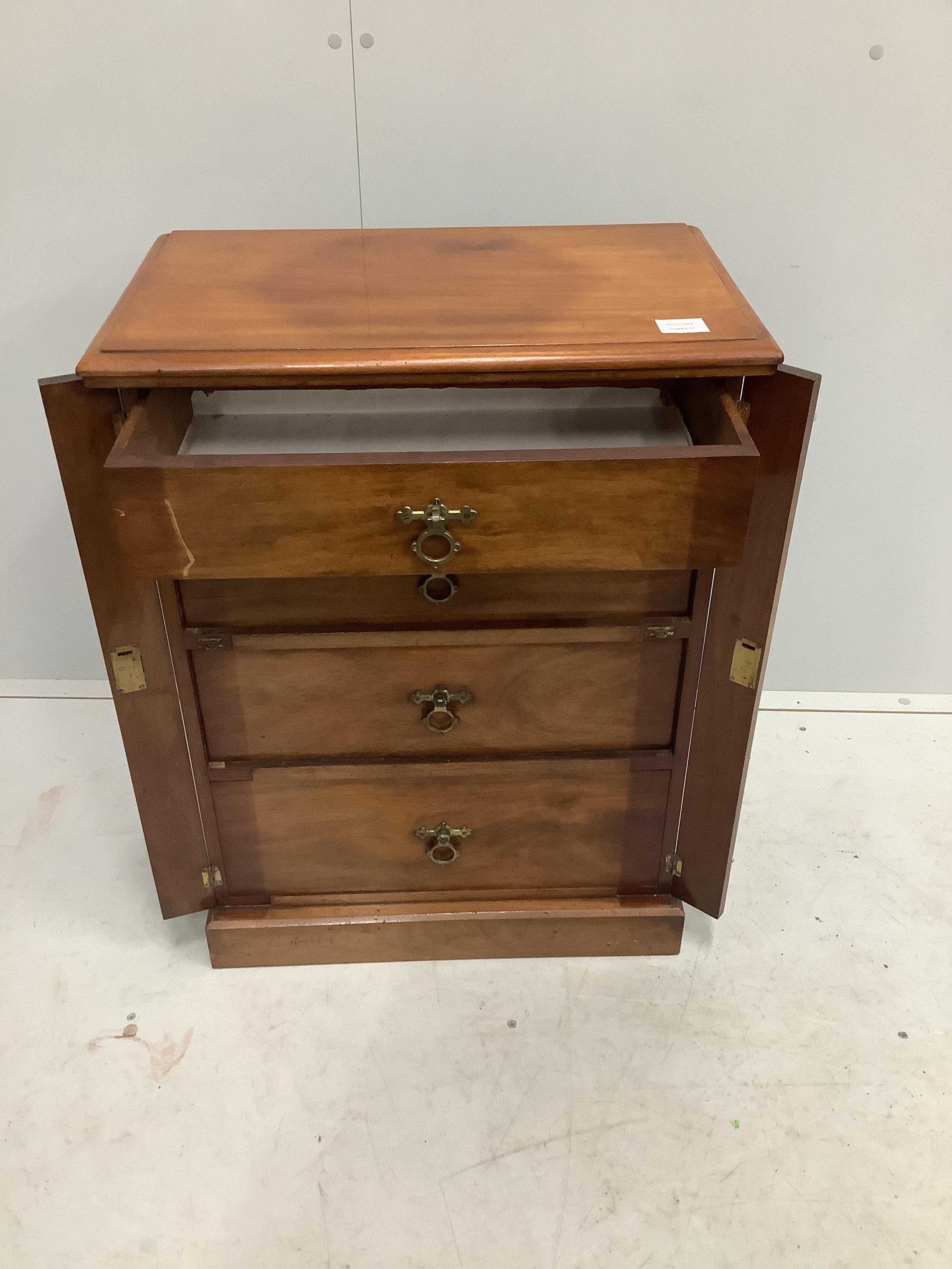 A late Victorian walnut four drawer wellington style chest, brass plaque inscribed 'E A M Fry, May 1884', width 58cm, depth 35cm, height 76cm